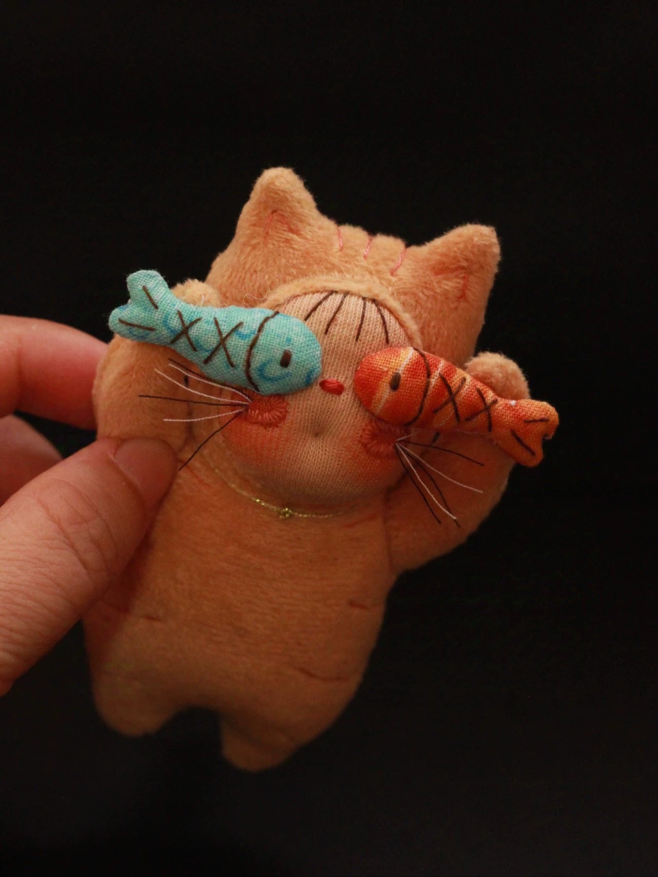 two fish orange cat