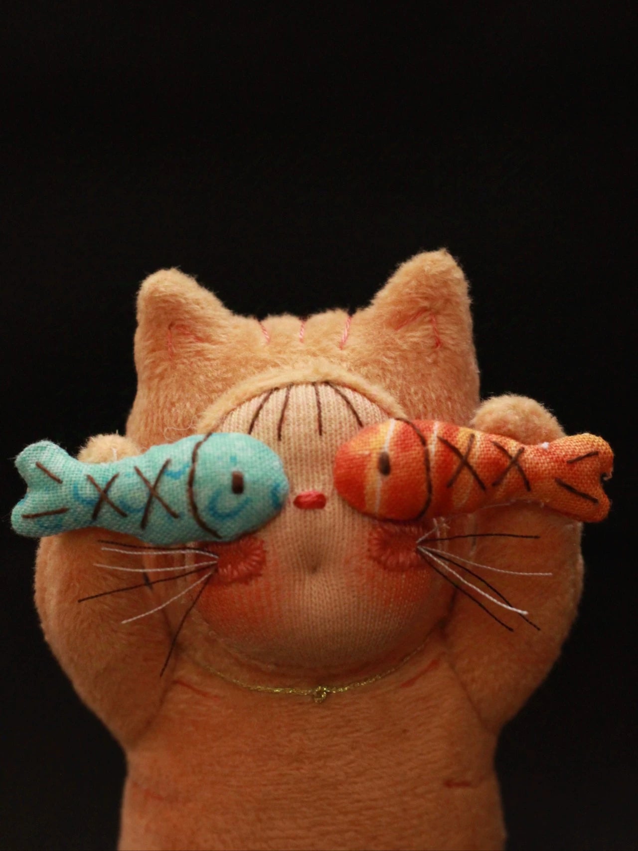 two fish orange cat
