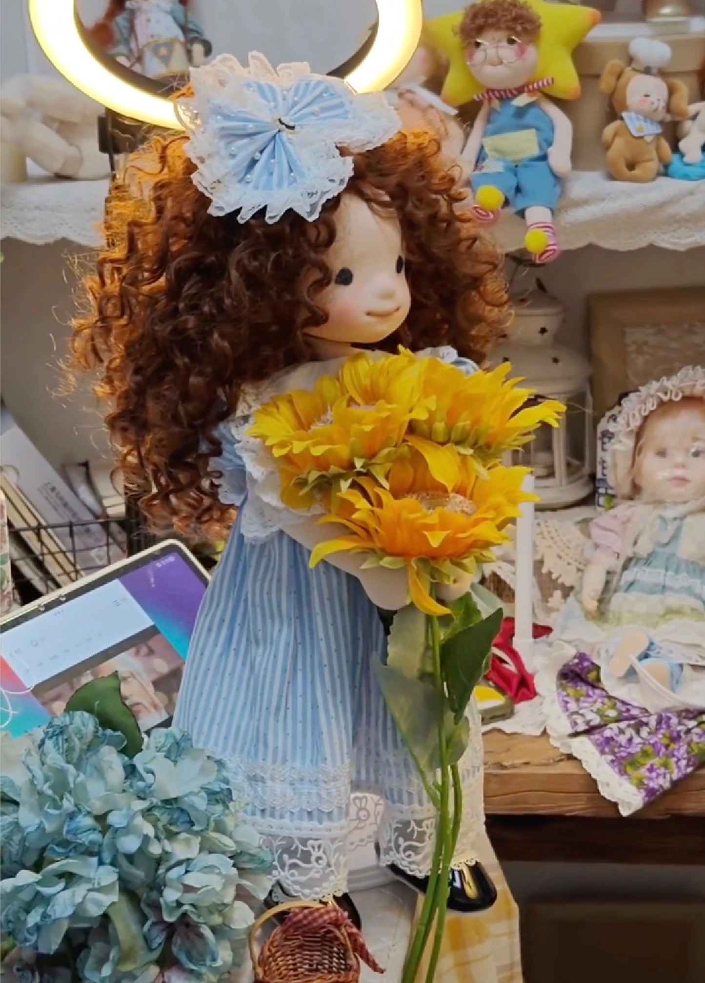 little girl holding sunflowers