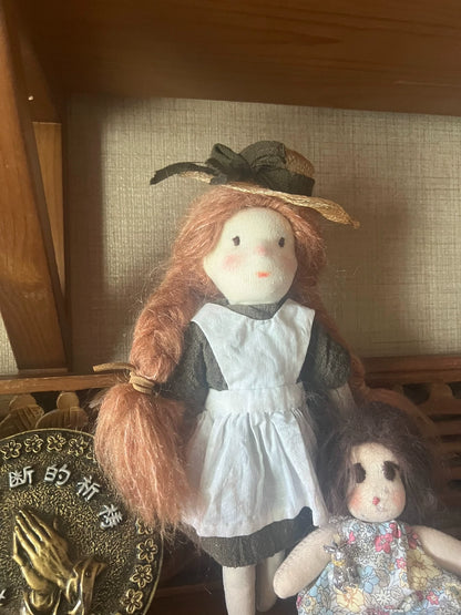 little girl wearing straw hat