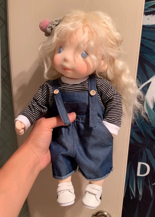 little girl wearing overalls
