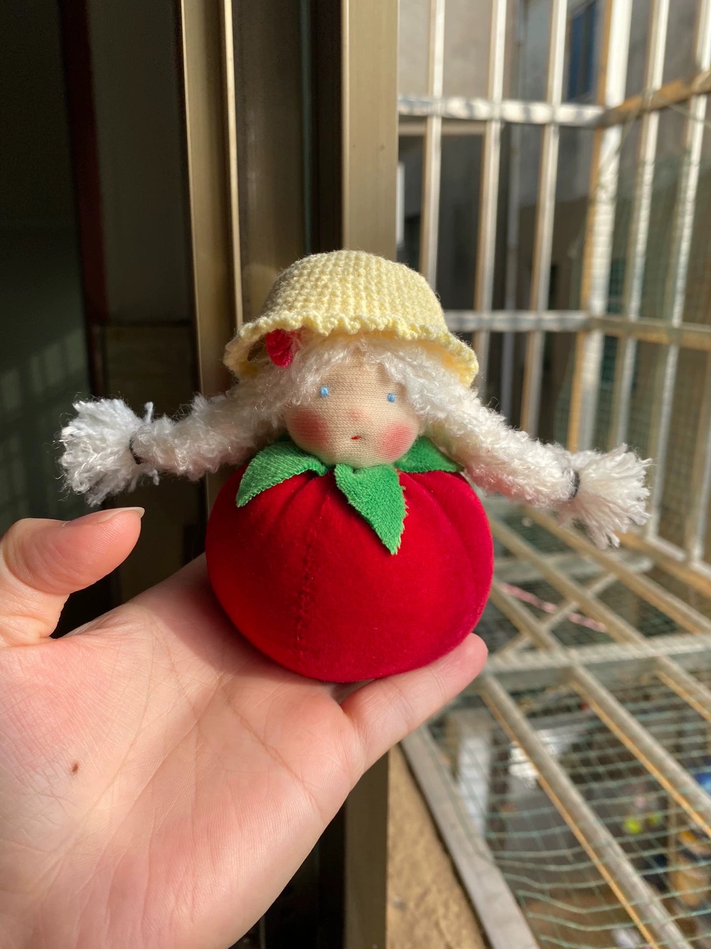 Hand-sewn tomato doll