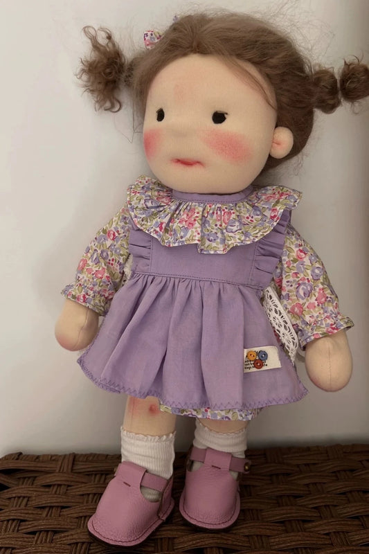 little girl in purple skirt