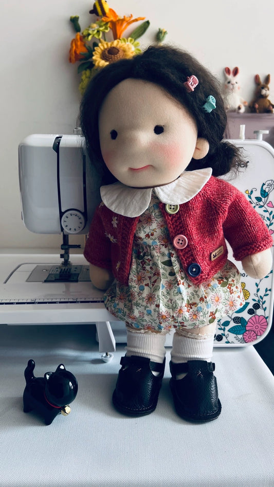 red sweater doll