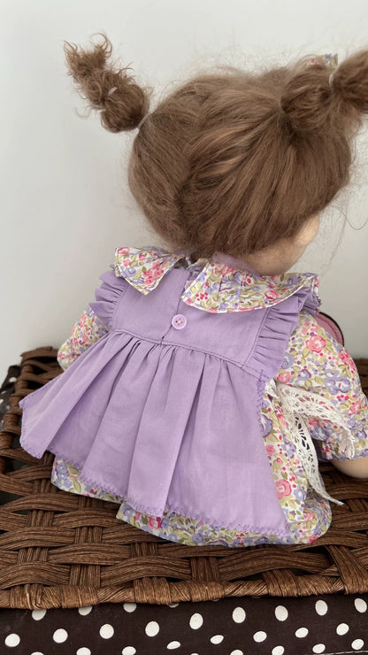 little girl in purple skirt