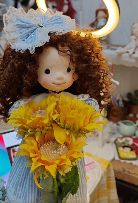 little girl holding sunflowers