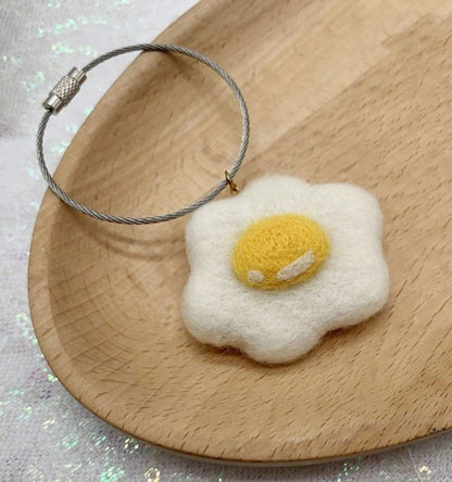 Wool felt poached egg pendant